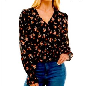 Brand new! “Ultra Flirt” size medium blouse. Flare sleeves, smocked waist